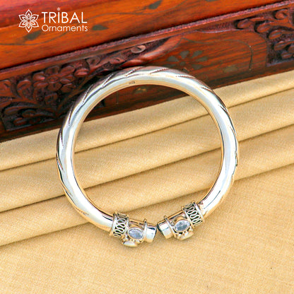 Sterling silver flexible bangle bracelet with blue turquoise stone, featuring a customized, stylish tribal-inspired design.