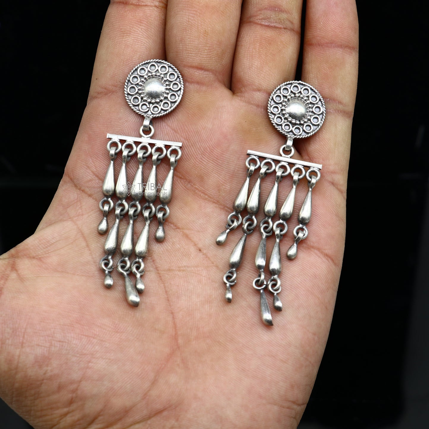 Sterling silver floral stud earring with stylish drop dangle design by TRIBAL ORNAMENTS, crafted with customized detailing.