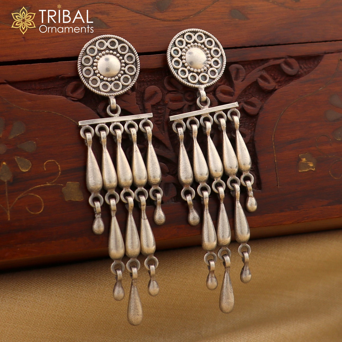 Sterling silver floral stud earring with stylish drop dangle design by TRIBAL ORNAMENTS, customized jewelry for elegant wear.