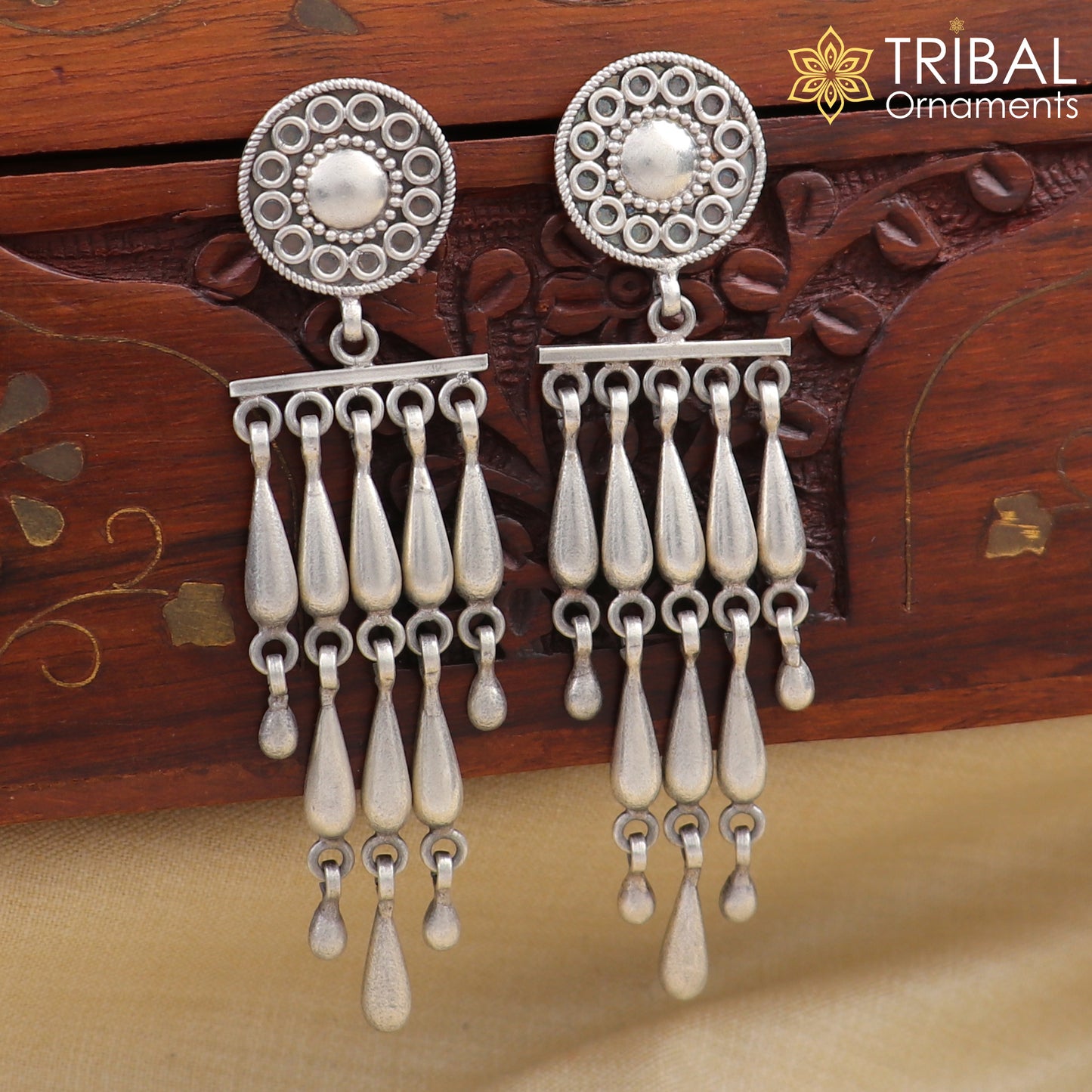 Sterling silver floral stud earring with stylish drop dangle design, crafted by TRIBAL ORNAMENTS.