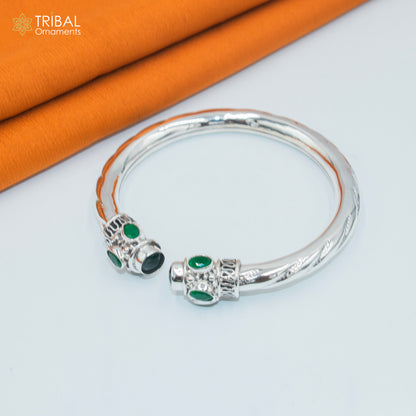 Sterling silver bangle with green turquoise stone, tribal jewelry cuff bracelet, customizable tribal ornament design.