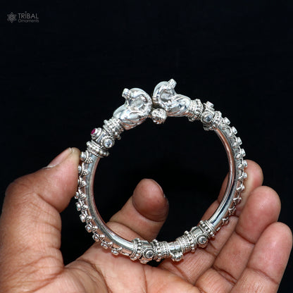 Sterling silver customized peacock bangle from Tribal Ornaments featuring tribal design, intricate craftsmanship, and detailed peacock motif.