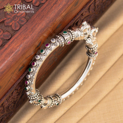 Sterling silver customized peacock bangle by TRIBAL ORNAMENTS featuring tribal jewelry design with intricate peacock motifs.