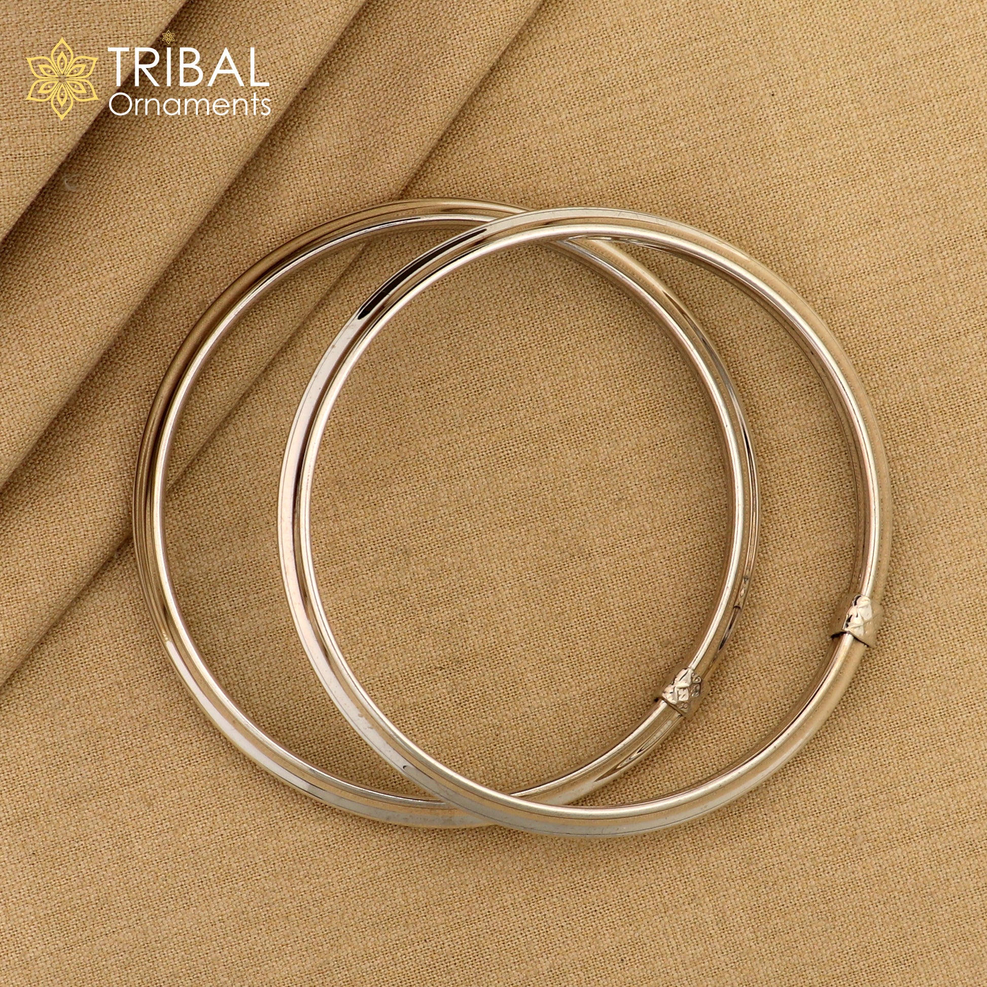 Sterling silver customized stylish bangle bracelet with a shiny, flexible design, tribal jewelry by TRIBAL ORNAMENTS.