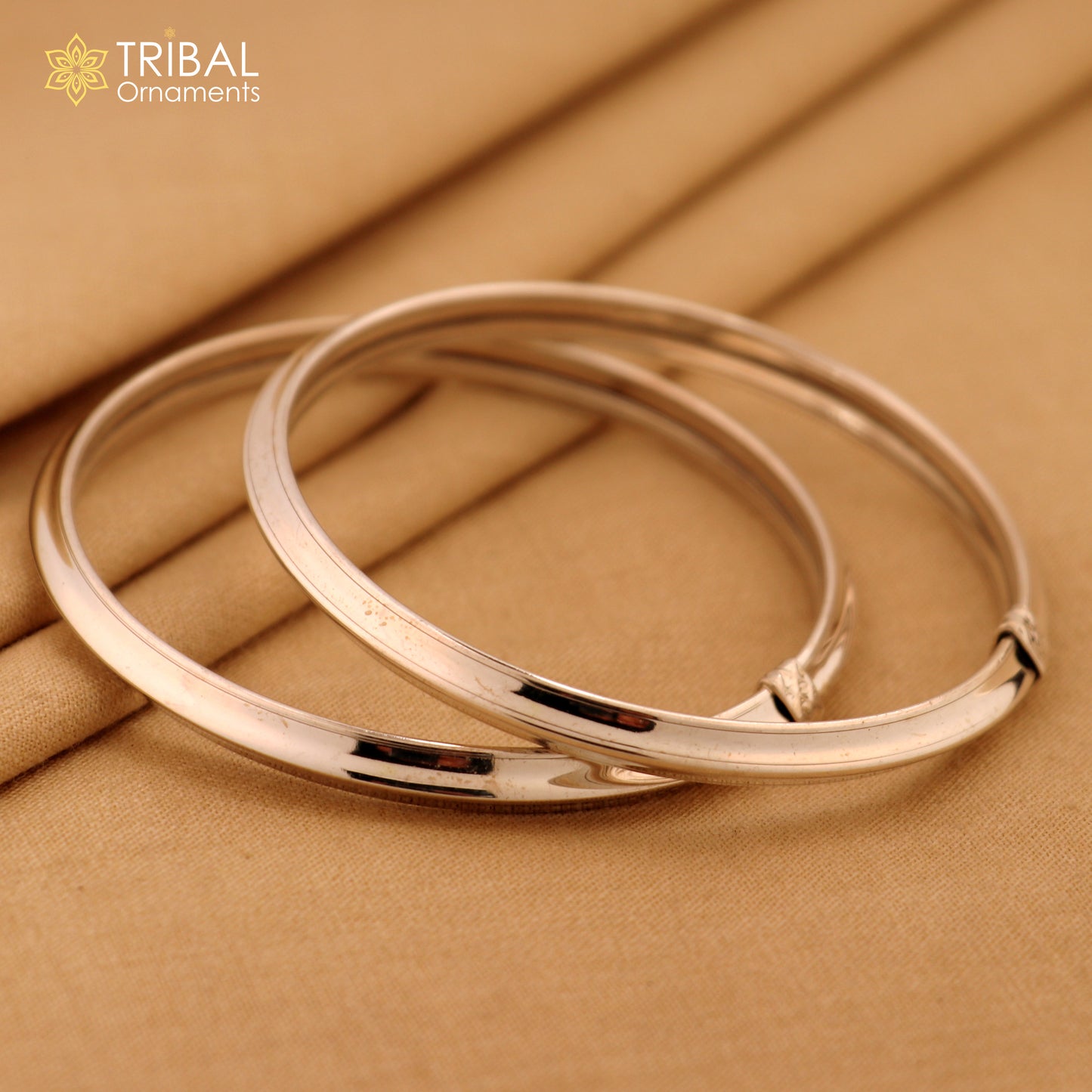 Sterling silver customizable shiny bangle bracelet by TRIBAL ORNAMENTS, stylish flexible tribal jewelry kada.