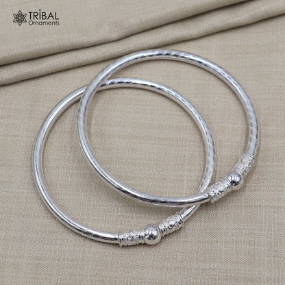 Sterling silver customized ball design bangle kada from TRIBAL ORNAMENTS featuring tribal-style jewelry details.