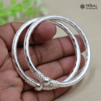 Sterling silver customized stylish ball design bangle kada tribal jewelry by TRIBAL ORNAMENTS featuring intricate tribal patterns