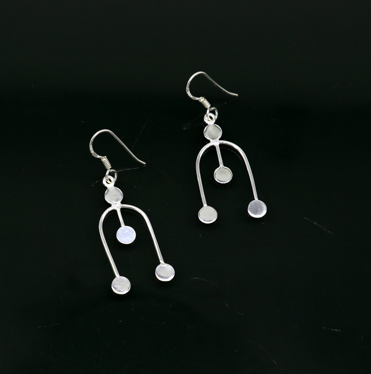 Sterling silver drop dangle hoop earring with unique tribal-inspired design and 925 stamp, fashionable jewelry for gifting or parties.