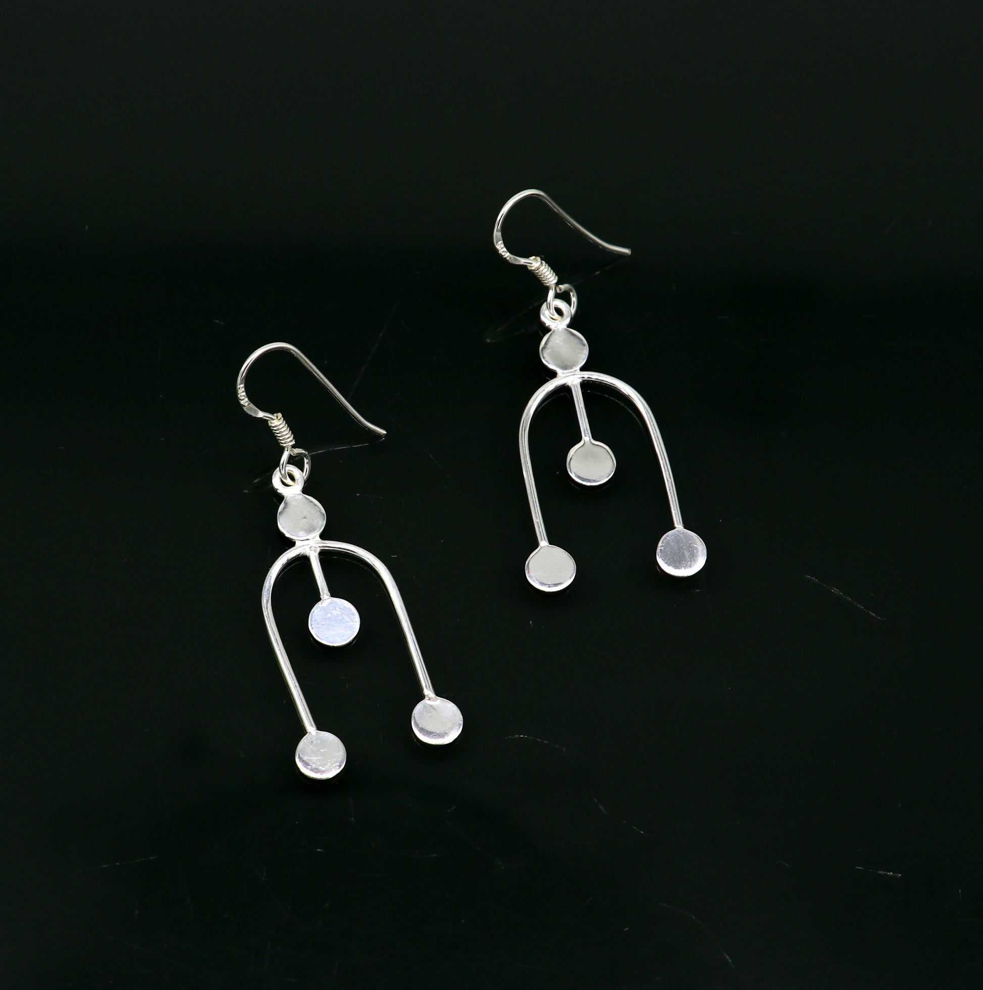 Sterling silver drop dangle hoop earring with unique tribal-inspired design and 925 stamp, fashionable jewelry for gifting or parties.