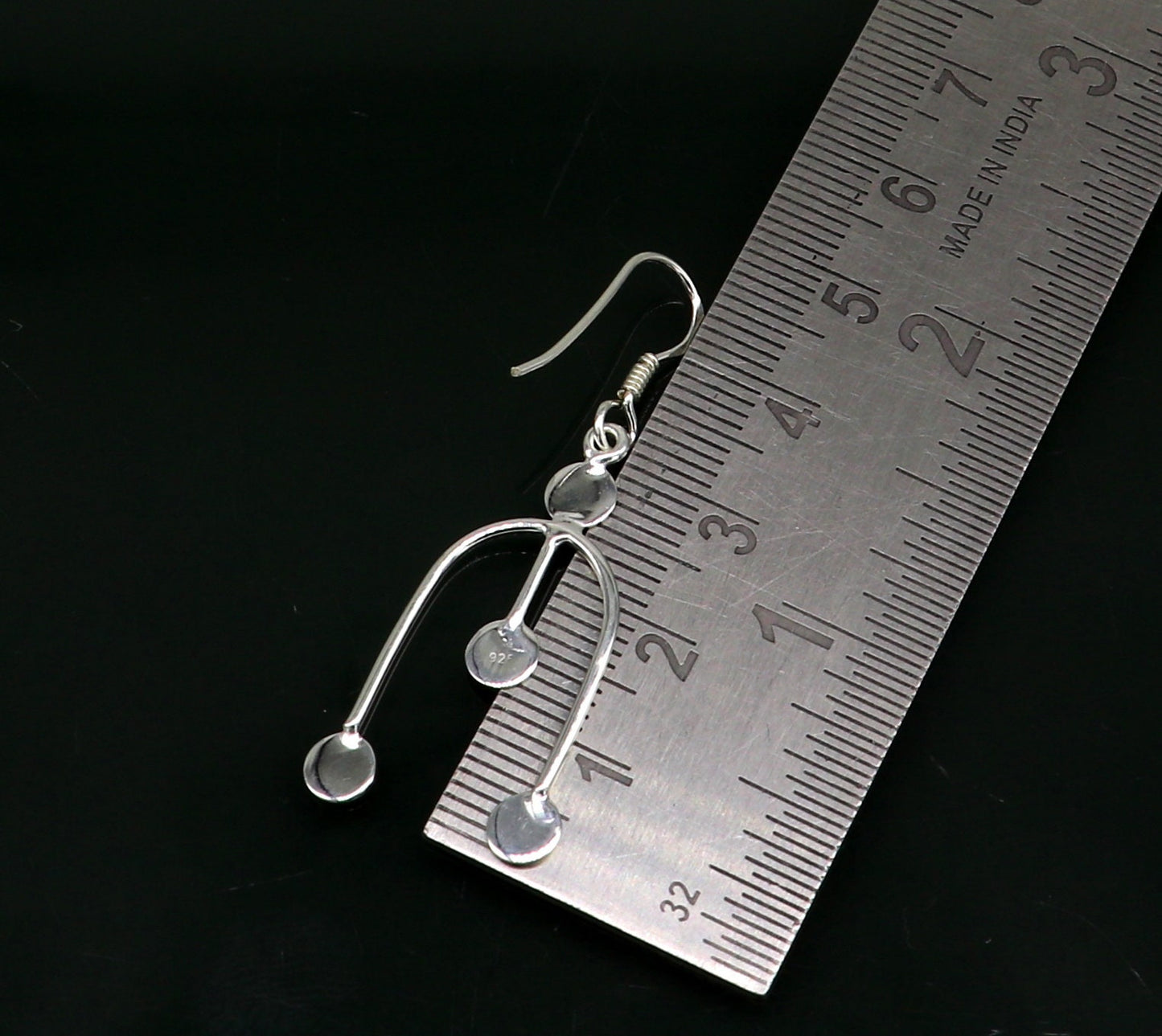 Sterling silver drop dangle hoop earring with unique custom design, stamped 925, stylish jewelry for gifting or parties.