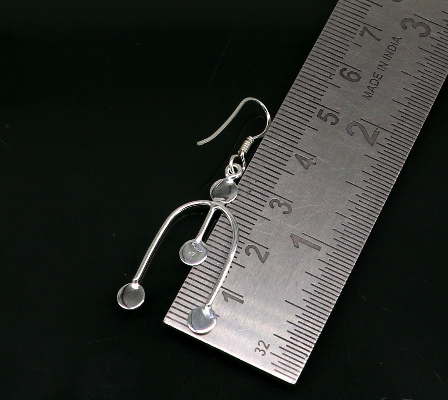 Sterling silver drop dangle hoop earring with unique custom design, stamped 925, stylish jewelry for gifting or parties.