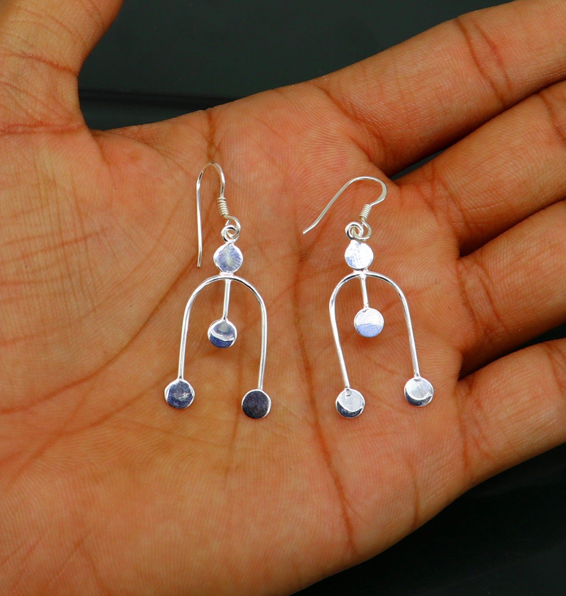 Sterling silver drop dangle hoop earring with unique design from TRIBAL ORNAMENTS, stamped 925, perfect for gifting or fashionable wear.