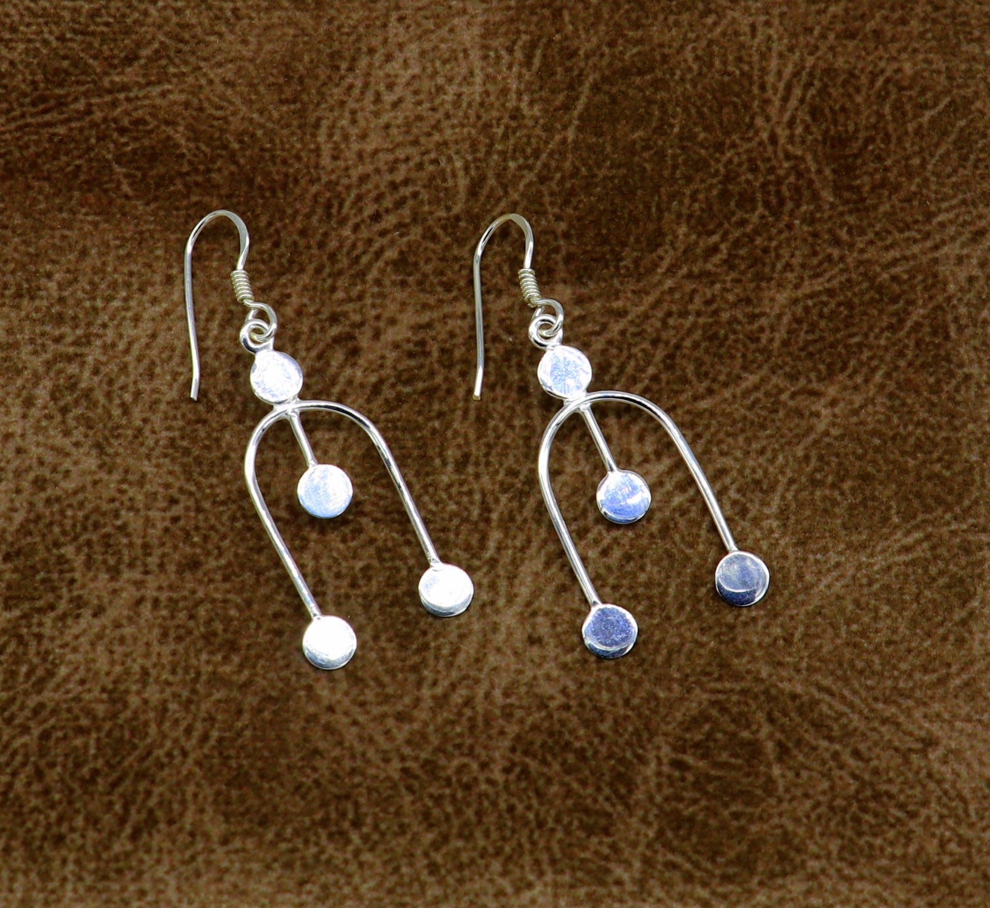 Sterling silver drop dangle hoop earring with unique tribal design, stamped 925, perfect for gifting or fashionable party jewelry.