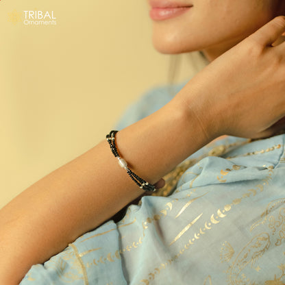 Sterling silver double chain anklet with black beads, lightweight and delicate jewelry by TRIBAL ORNAMENTS.