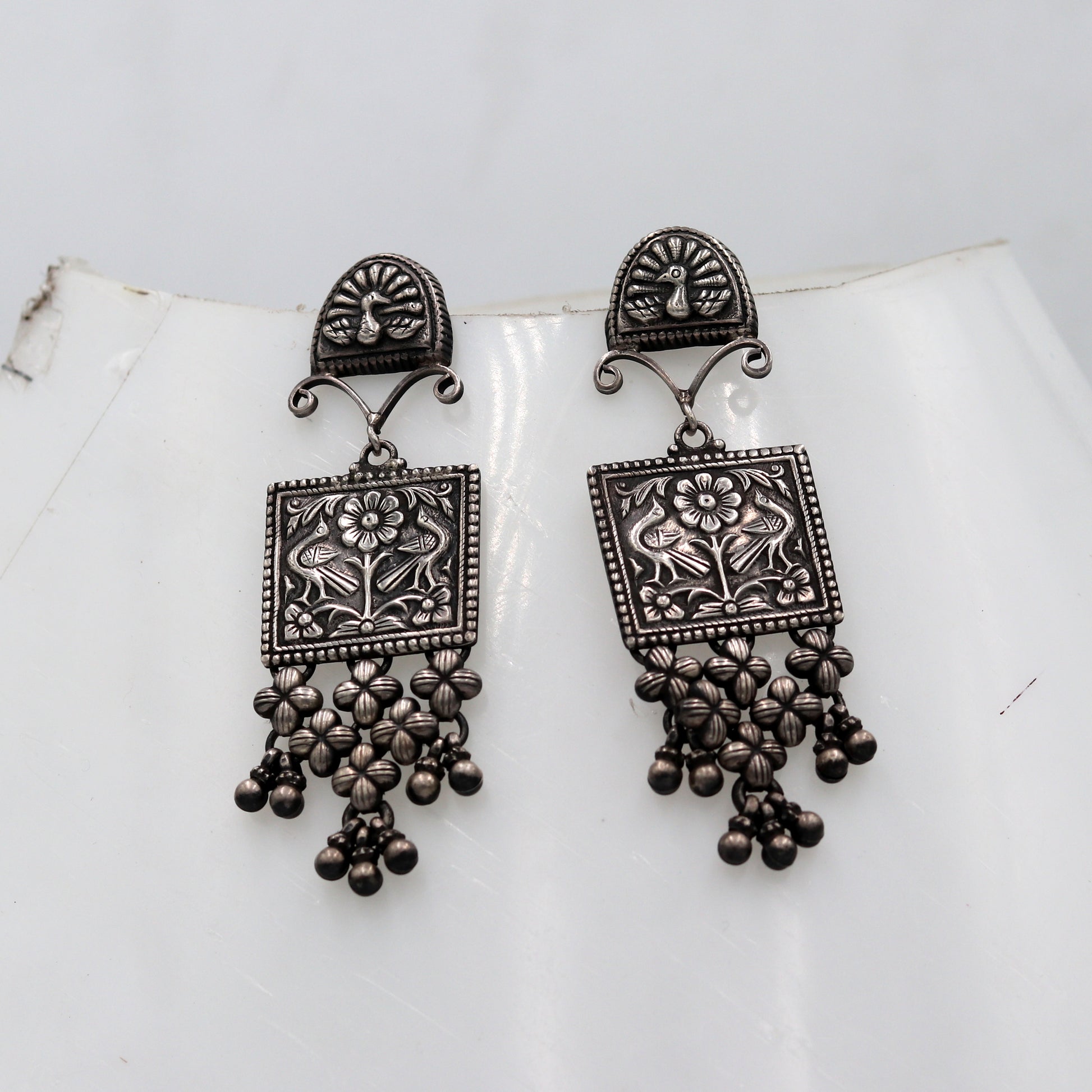 Sterling silver ethnic floral drop dangle earring by TRIBAL ORNAMENTS featuring traditional Banjara jewelry design.