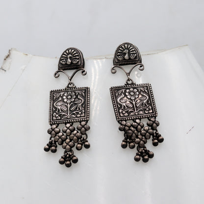 Sterling silver ethnic floral drop dangle earring by TRIBAL ORNAMENTS featuring traditional Banjara jewelry design.