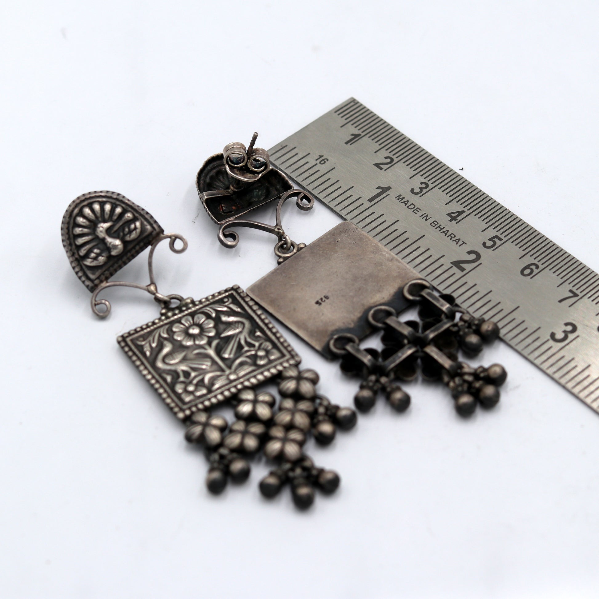 Sterling silver ethnic floral drop dangle earring with traditional Banjara design, detailed floral work in tribal jewelry style.