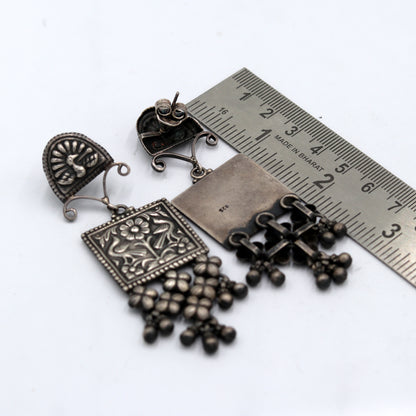 Sterling silver ethnic floral drop dangle earring with traditional Banjara design, detailed floral work in tribal jewelry style.