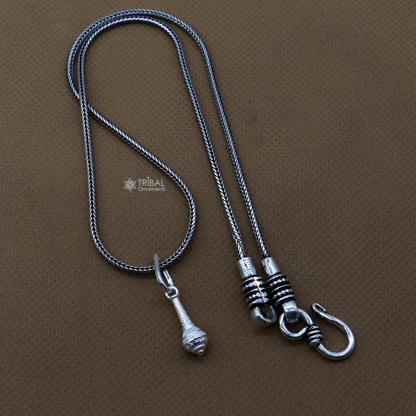 Sterling silver Hanuman weapon Gota pendant by Tribal Ornaments, stylish unisex jewelry with intricate Gada design.