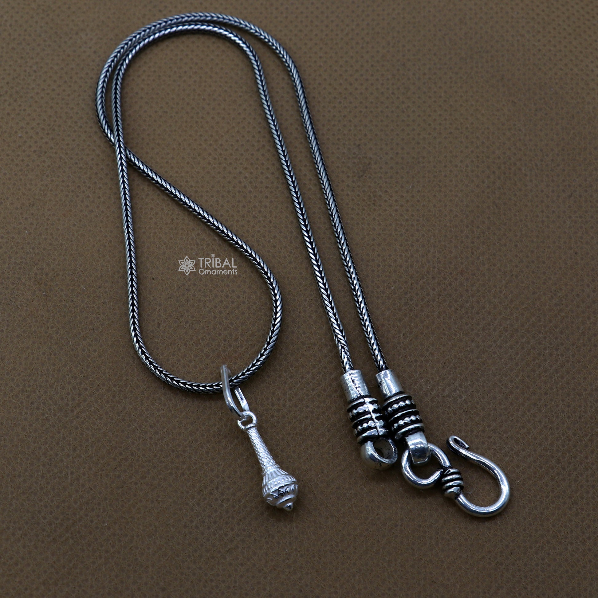 Sterling silver Hanuman weapon Gota pendant by Tribal Ornaments, stylish unisex jewelry with intricate Gada design.
