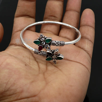 925 sterling silver cuff bangle bracelet with red and green cut stones, tribal-inspired design from TRIBAL ORNAMENTS.