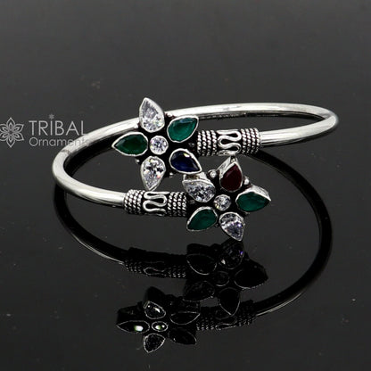 925 sterling silver cuff bangle bracelet with red and green cut stones, tribal design, by Tribal Ornaments.