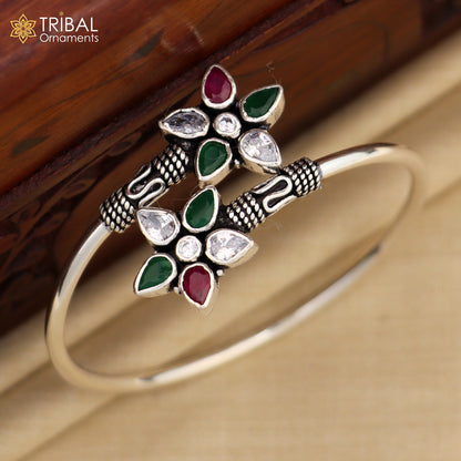 925 sterling silver cuff bangle bracelet with red and green cut stones, tribal-inspired design by TRIBAL ORNAMENTS.