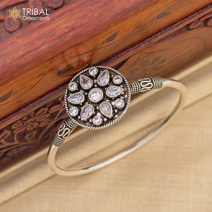 Sterling silver bangle bracelet with a stunning cut stone, featuring a cuff design from Tribal Ornaments, perfect for personalized jewelry.
