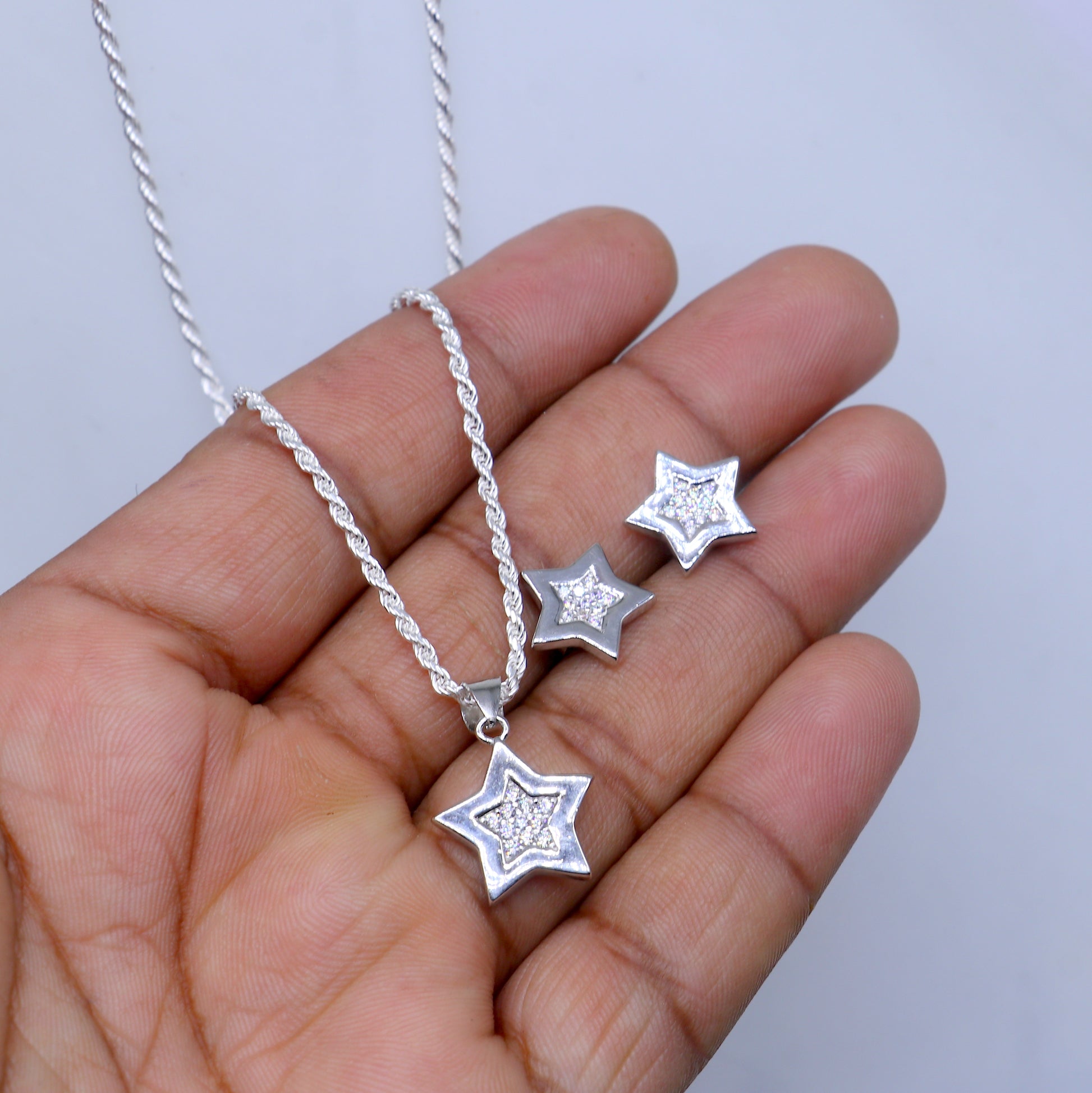 Sterling silver star pendant set with sparkling cubic zirconia stones, stylish jewelry from TRIBAL ORNAMENTS.