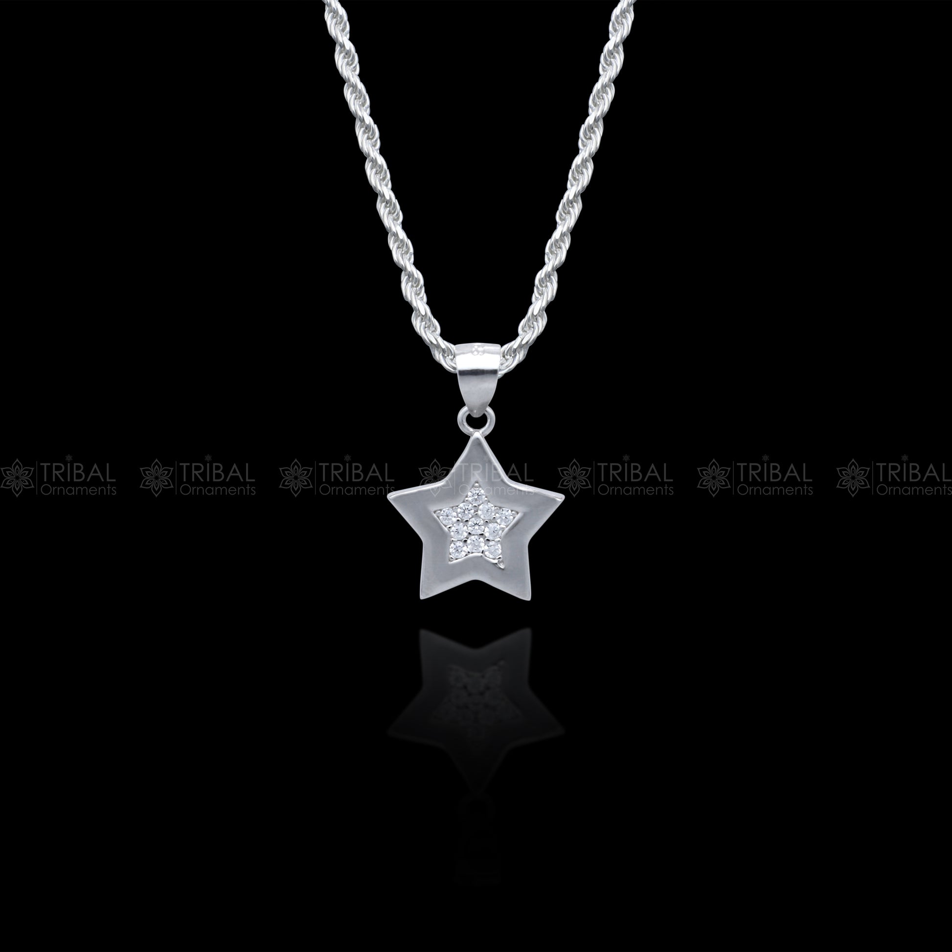 Sterling silver star pendant set with diamond cubic zirconia stones, stylish jewelry by TRIBAL ORNAMENTS.