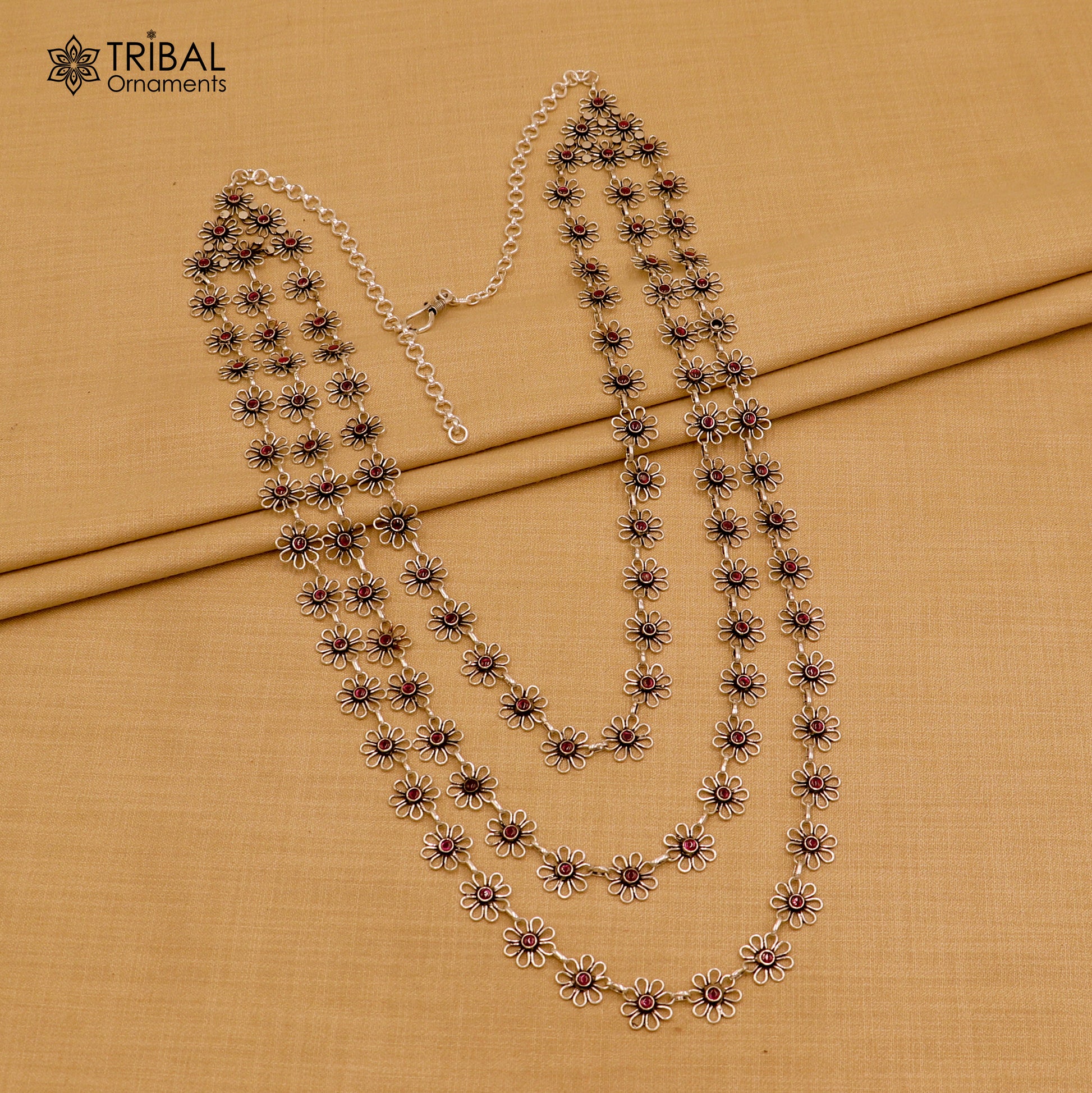 Sterling silver floral style red stone 3-line necklace set by TRIBAL ORNAMENTS, featuring ethnic jewelry with intricate design.