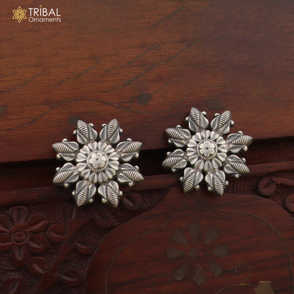 Sterling silver flower design stud earring by TRIBAL ORNAMENTS, stylish jewelry accessory with intricate floral pattern.