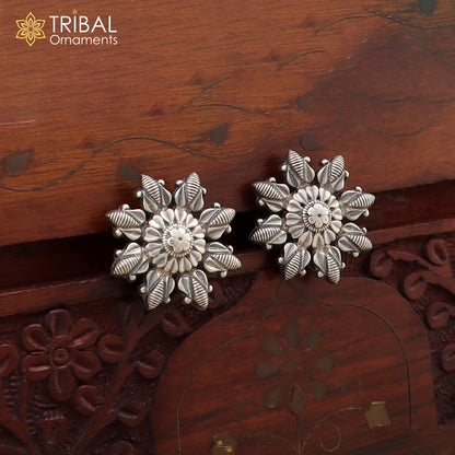 Sterling silver flower design stylish stud earring from TRIBAL ORNAMENTS, showcasing intricate floral pattern and polished finish.