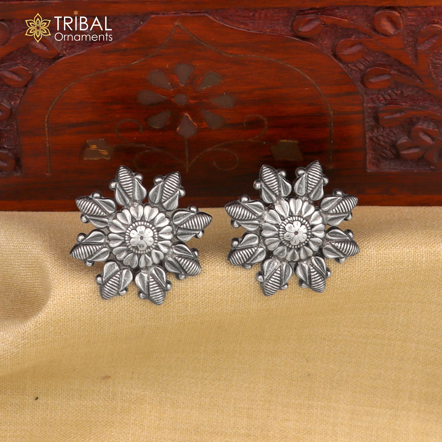 Sterling silver flower design stud earring from TRIBAL ORNAMENTS, stylish and detailed jewelry accessory.