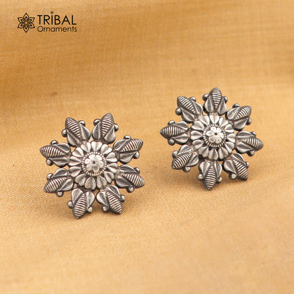 Sterling silver flower design stud earring by TRIBAL ORNAMENTS, stylish jewelry with intricate floral details.