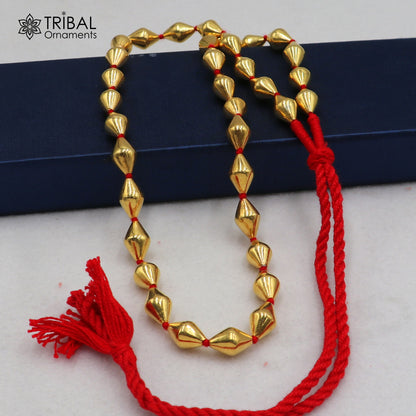Sterling silver and gold polished dholki beaded necklace from TRIBAL ORNAMENTS tribal jewelry set featuring traditional design.
