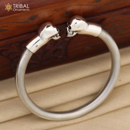 Sterling silver hip-hop skull design bangle bracelet from TRIBAL ORNAMENTS, unisex personalized jewelry with bold skull detail.
