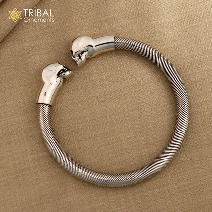 Sterling silver hip-hop skull design bangle bracelet by Tribal Ornaments, unisex cuff jewelry with personalized engraving.