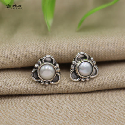 Sterling silver pearl stone stud earring by TRIBAL ORNAMENTS, unisex jewelry with elegant pearl and silver design.