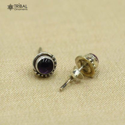 Sterling silver round amethyst stone stud earring, unisex jewelry by Tribal Ornaments, showcasing a polished purple gemstone.