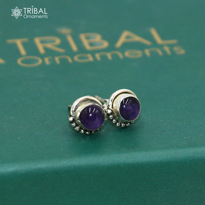Sterling silver round amethyst stud earring from Tribal Ornaments, unisex jewelry with a polished purple gemstone.