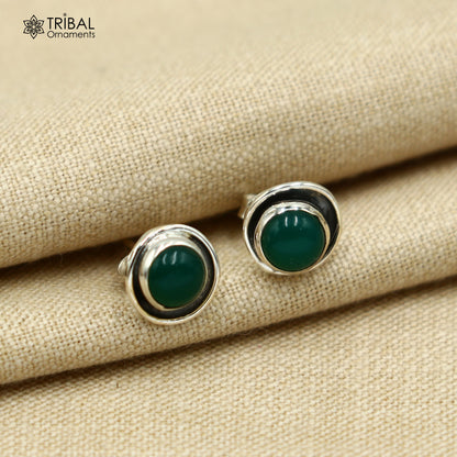 Sterling silver stud earring with round green onyx stone, unisex jewelry by TRIBAL ORNAMENTS, showcasing elegant design.