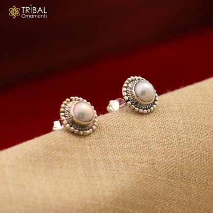 Sterling silver round pearl stud earring from Tribal Ornaments, unisex jewelry with a polished pearl stone design