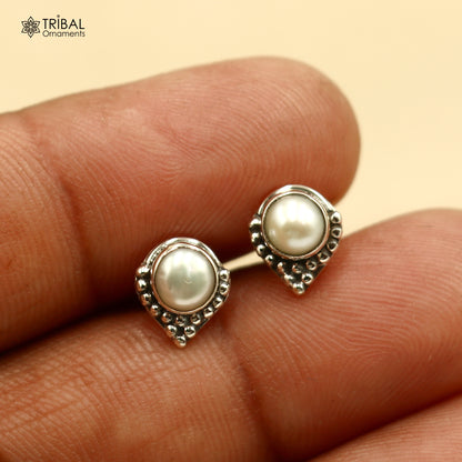 Sterling silver round pearl stud earring from TRIBAL ORNAMENTS, unisex jewelry with elegant pearl stone design.