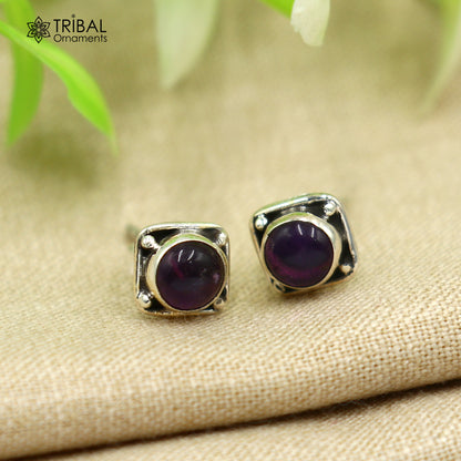 Sterling silver square-shaped amethyst stud earring by Tribal Ornaments, unisex jewelry with a polished gemstone appearance.