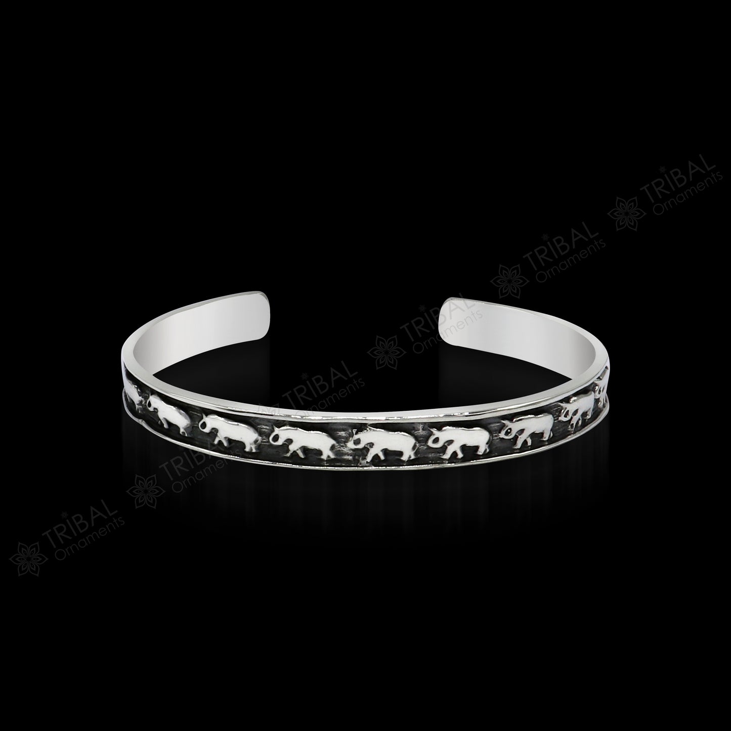 Sterling silver elephant design cuff bracelet by Tribal Ornaments, featuring a waved open-face bangle, perfect for gifting or unisex wear.