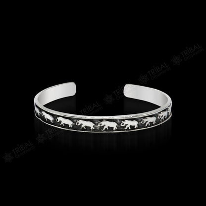 Sterling silver elephant design cuff bracelet by Tribal Ornaments, featuring a waved open-face bangle, perfect for gifting or unisex wear.