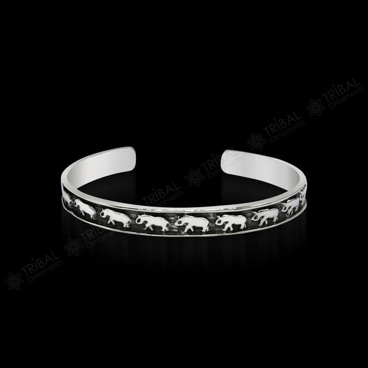 Sterling silver elephant design cuff bracelet by Tribal Ornaments, featuring a waved open-face bangle, perfect for gifting or unisex wear.