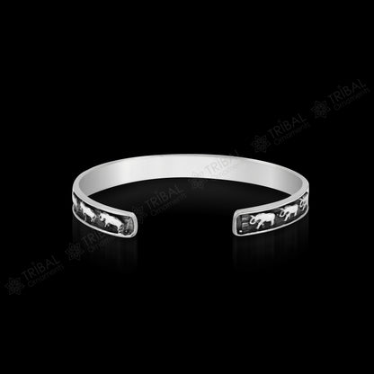 Sterling silver elephant design bangle cuff bracelet by TRIBAL ORNAMENTS, open-face with wavy details, unisex jewelry, gift-ready.