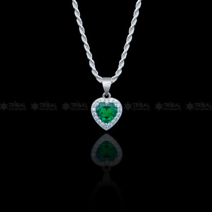 925 Sterling silver heart-shaped pendant set with green emerald diamonds, featuring intricate tribal ornament design.